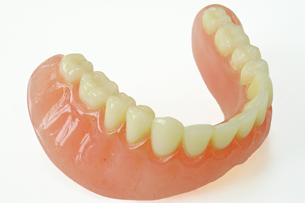 An image of the lower half of a set of dentures